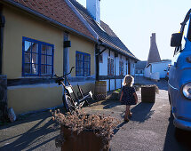 Girl 2-3 years, walking on street, Arsdale, Bornholm, Denmark