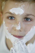 Boy with cream in his face, Body Care People Wellness