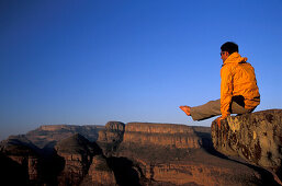 Man practice L-sits, Three Rondavels, Blyde River Canyon, South Africa