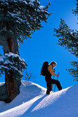 A woman snowshoeing, Kolm Saigurn, Hohe Tauern, Salzburg, Austria