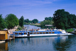 Tourboat at landing stage, canal near Plau, Mecklenburg Lake District, Mecklenburg-Western Pomerania, Germany