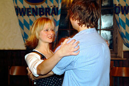 Kathrein dance, young couple dancing at Loewenbraeukeller, Munich, Bavaria, Germany, Europe