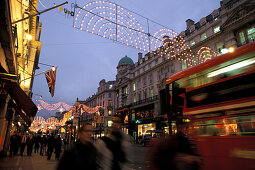 Christmas lights above people at Regent Street, London, England, Great Britain, Europe