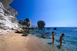 Two women at the beach, Plage de Sutta Rocca, cliffs of Bonifacio, Corsica, France