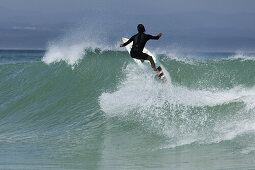 Surfer on the world famous supertubes waves, Jeffreys Bay, Eastern Cape, South Africa, Africa