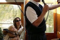 Tourist guide on excursion boat, Tourist guide on excursion boat, St.Bartholomae, Koenigssee, Berchtesgaden, Bavaria, Fremdenfuehrer, Ausflugsboot bei St.Bartholomae, Koenigssee, Berchtesgaden, Bayern, Deutschland