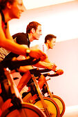 Spinning, Men and woman in gym on exercise bikes, Spinning, leos Sports Club Muenchen