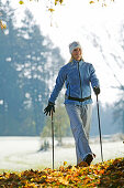 Young woman Nordic Walking, Bavaria, Germany