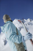 Female skier looking to mount Grieskogel, Kuhtai, Tyrol, Austria