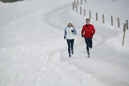 Young couple running on trail