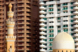 Minaret of a mosque in front of high rise buildings, Dubai, UAE, United Arab Emirates, Middle East, Asia