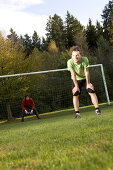 Young men playing soccer