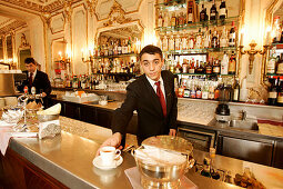 Waiter at the counter of Cafe Piatti, Torino, Piedmont, Italy, Europe