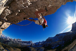 Man freeclimbing at rock formation, Cinque Torri, Dolomites, Province of Belluno, Veneto, Italy
