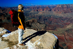 Woman admiring the view over the Grand Canyon, hiking in the Grand Canyon National Park, Arizona, USA