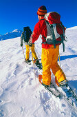 Young couple snowshoeing, Serfaus, Tyrol, Austria