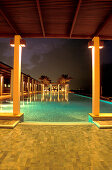 The illuminated Chedi Pool at night, The Chedi Hotel, Muscat, Oman, Middle East, Asia