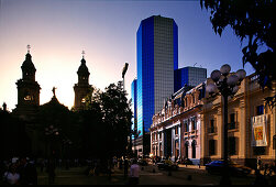 Cathedral and high rise building at sunset, Plaza de Armas, Santiago de Chile, Chile, South America, America