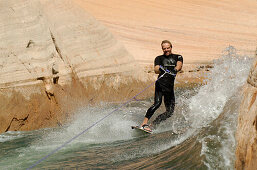 A man wakeboarding on Lake Powell, Arizona, USA