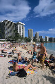 Sunbathing on Waikiki Beach, Honolulu, Oahu, Hawaii, USA