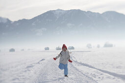 Girl 5-6 Years, running on snow