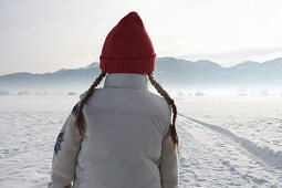 Girl 5-6 Years, standing in winter scenery, rearview