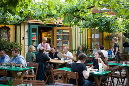 Guests sitting in the garden of Heuriger Mayer am Pfarrplatz, Heiligenstadt, Vienna, Austria