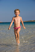 Child at Cala Brandinchi Beach, eastcoast, Sardinia, Italy