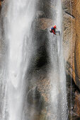 Canyoning, Man abseiling through a waterfall, Corsica Raid, Piscia di Gallu, Ospedale, Corsica, Mediterranean, France