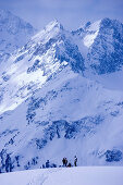 Snowcovered mountain scenery, skier standing in the background, Kuehtai, Tyrol, Austria