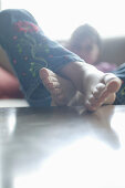 Girl with feet on table