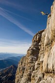 Base jumping from the rock face of Dachstein Mountain, Austria