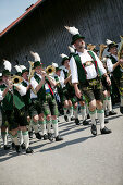 Band in traditional bavarian clothes,during a festival on 1st of mai, Münsing, Bavaria, Germany