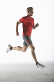 Runner, young man (20-25y) in motion