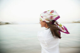 Young woman with headscarf, blurred motion