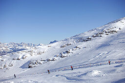 People on ski lift, Gruppo della Marmolada, Dolomites, Italy