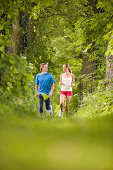 Couple jogging in woods