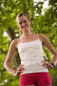 Woman in sport clothing standing hands on hips