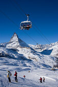 People on ski lift and slope, Matterhorn in background, Zermatt, Valais, Switzerland