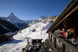 People sitting on terrace of Restaurant Chez Vrony, Design by Heinz Julen (2080 m), Findeln, Zermatt, Valais, Switzerland