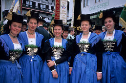 five young women wearing dirndl dresses, pilgrimage to Maria Eck, Siegsdorf, Chiemgau, Upper Bavaria, Bavaria, Germany