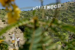 tourists in front of the Hollywood sign, emblem, Los Angeles, L.A., Caifornia, U.S.A., United States of America