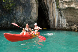 Couple kayaking around Ko Hong, Phang Nga bay, Krabi, Thailand, after the tsunami