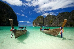 Two boats anchoring in the Maya Bay, a beautiful scenic lagoon, famous for the Hollywood film "The Beach", Ko Phi-Phi Leh, Ko Phi-Phi Islands, Krabi, Thailand, after the tsunami