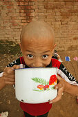 young boy at breakfast,  one of many new Kung Fu schools in Dengfeng, near Shaolin, Song Shan, Henan province, China, Asia