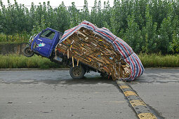 Heavy load, overloaded three-wheeler, China, Asia