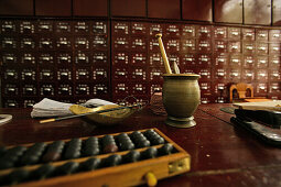Interior view of a deserted pharmacy, view at mortar and drawers, Chengdu, China, Asia
