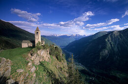 Church of San Romerio above the Puschlav valley with Bergamask alps in the background, Puschlav, Grisons, Switzerland