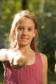 Girl holding a spoon with an egg, children's birthday party