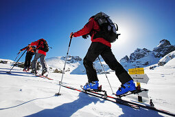A group of people on a ski tour to the top of the Popova Kapa in the Rila Mountains, Europe, Bulgaria